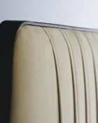 London Shown in Pebblestone Finish with Cream Velvet Performance Fabric headboard